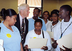 students at the University Academy in Kansas City present Dr. Billington with their original creative works