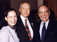 Sen. Mitchell (right) enjoys the celebration with his wife, Heather, and former congressional colleague Sen. Orrin Hatch (R-Utah).