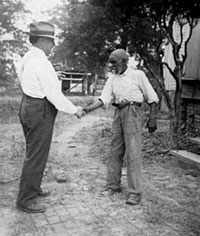 Uncle Rich Brown (right) and John Lomax at the home of Julia Killingsworth near Sumterville, Ala., Oct. 1940.