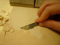 Thinning the mount with a scalpel.