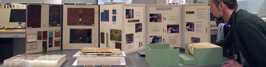 Tabletop displays depicting historical book structures and materials