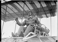 Clifford B. Harmon. Seated in airplane.