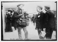 Street vendor showing Christmas toys to boys 23rd., St. New York