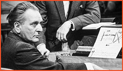 man sitting at piano