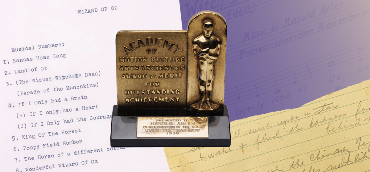 Harold Arlens Academy Award Oscar for the music for the song Over the Rainbow from 1930 on a colorful collage of lyrics and sheet music.