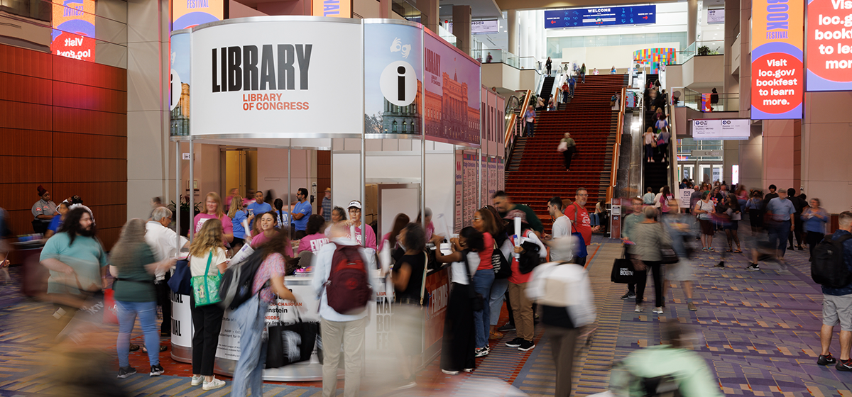 A crowd of people move through the lobby during the 2024 Library of Congress National Book Festival at the Washington Convention Center.
