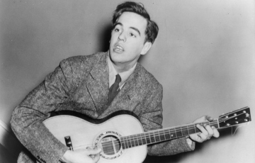 A man playing a guitar