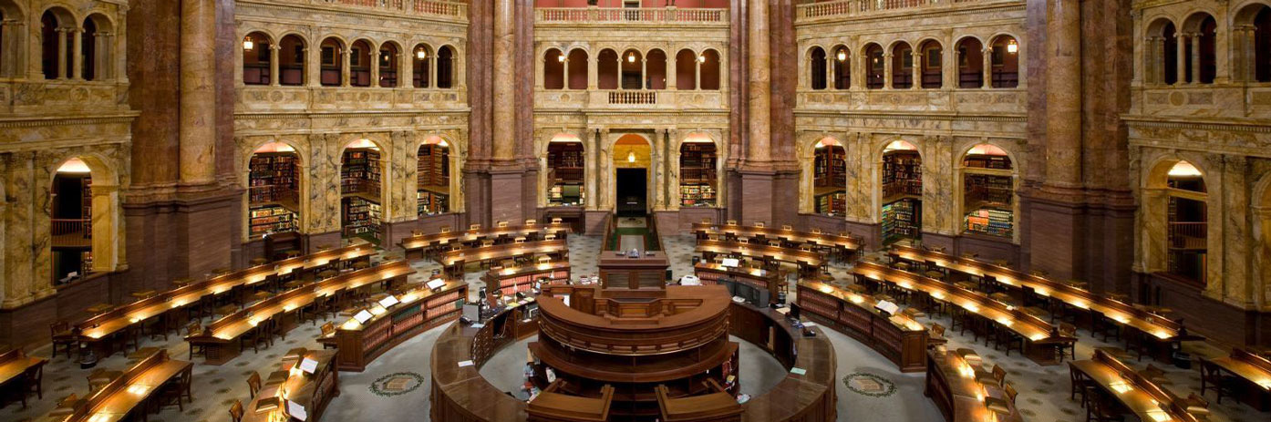 Overhead view of the circulation desk and researcher desks inside the Main Reading Room of the Library of Congress