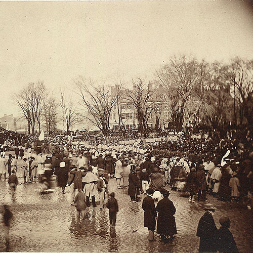 Detail of a black and white photograph showing crowds near the East front of the Capitol building grounds during Lincoln's second inauguration.
